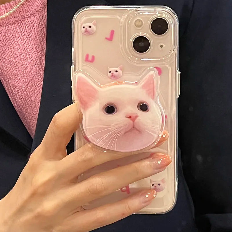 a white cat popsocket phone case with some letters and cat heads on