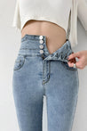 Cut Out Cross Waistband Skinny Jeans
