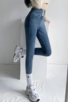 Cut Out Cross Waistband Skinny Jeans