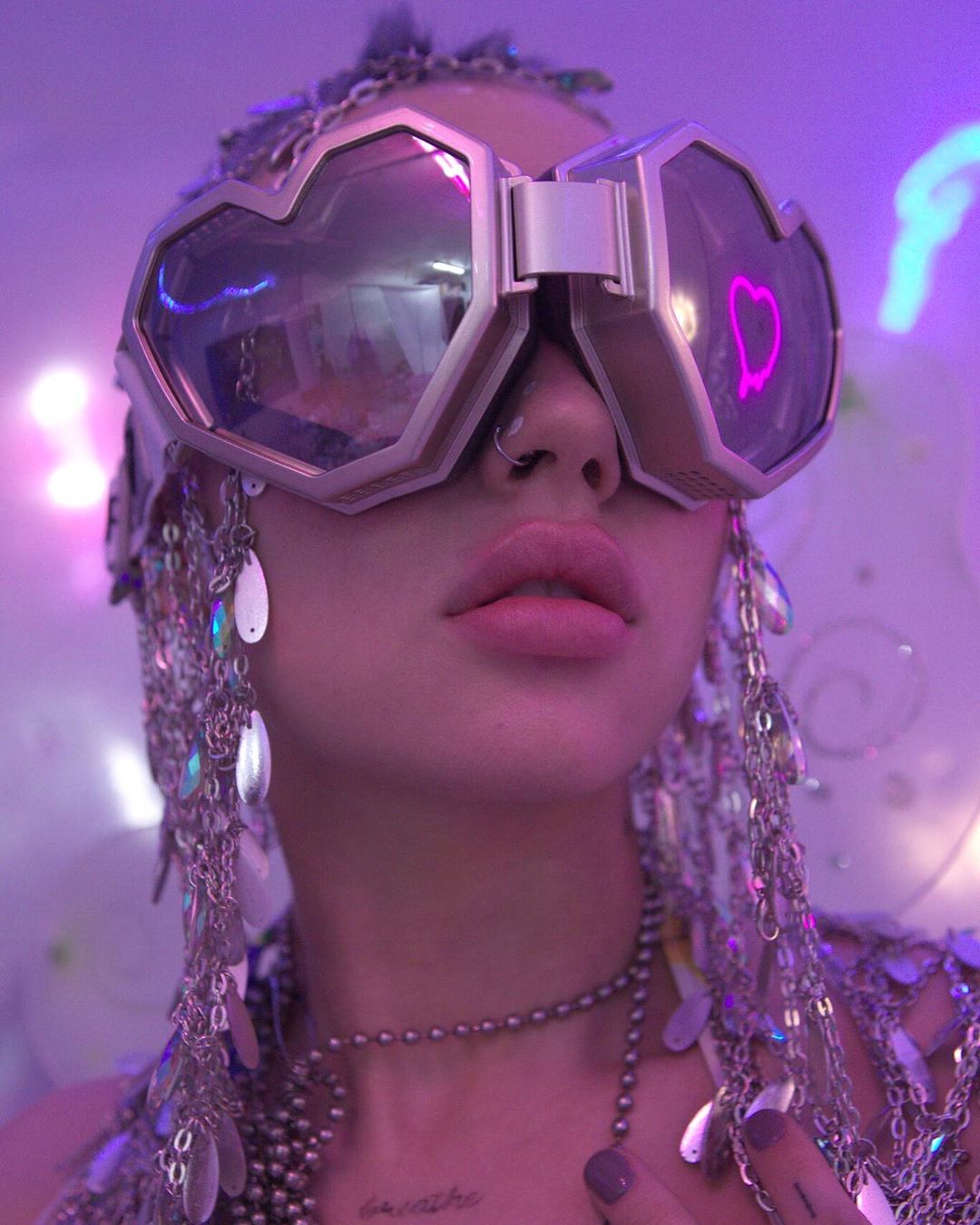a girl wearing heart shaped disco cowgirl oversized party sunglasses
