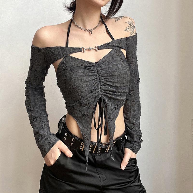 a girl wearing a gray fairy grunge detachable sleeve halter top with a studded belt