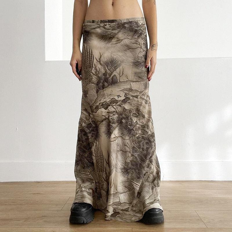 a girl is wearing a fairy grunge forest maxi skirt with forest themed details