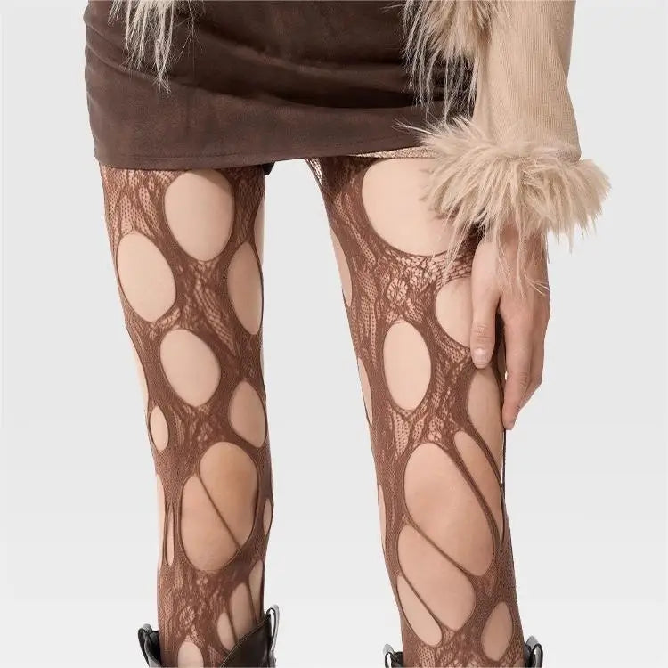 a girl is wearing brown grunge cut-out tights with distressed open knit pattern