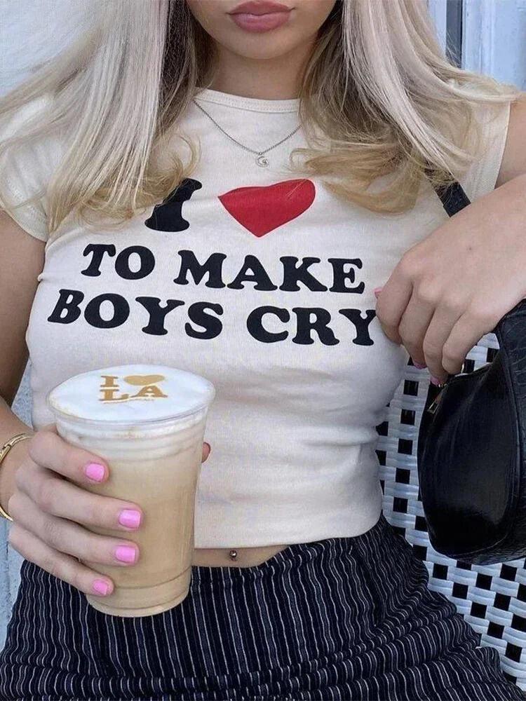 a girl is wearing an i love to make boys cry baby tee in white for acubi fashion