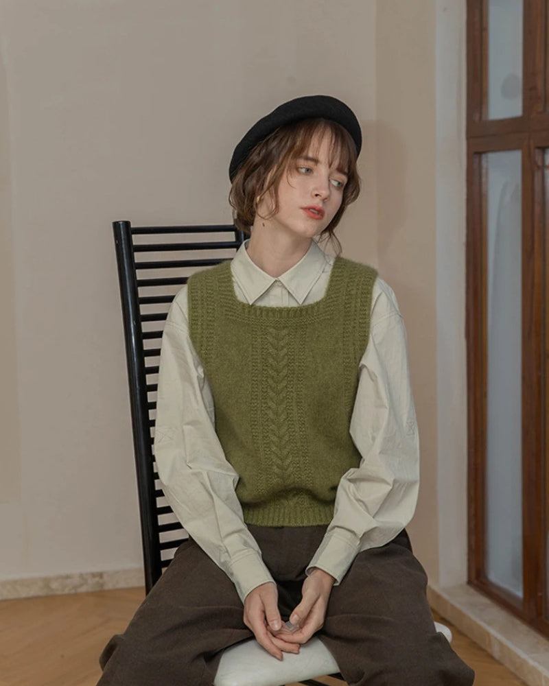 A classic sweater vest embodying the Light Academia aesthetic, perfect for layering over shirts or blouses.