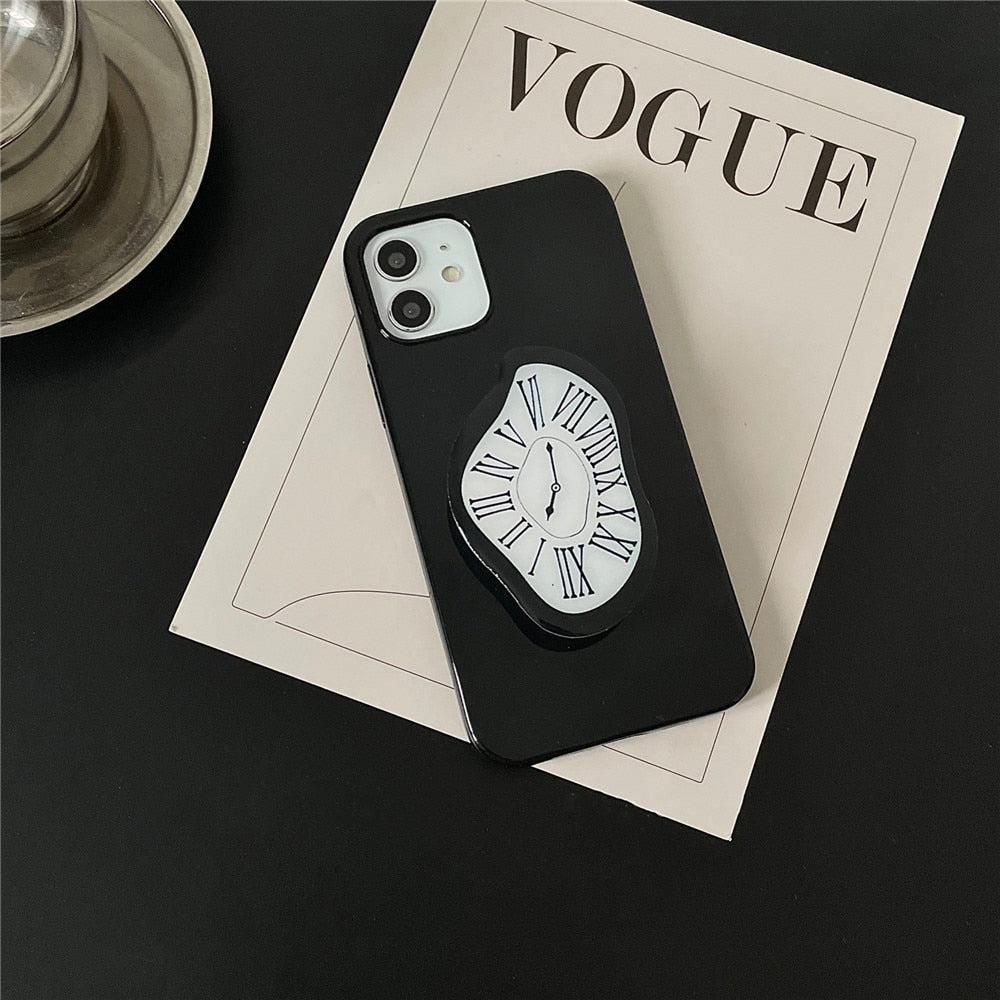 there is an art hoe aesthetic salvador dali melting clock phone case in black and white on a vogue magazine