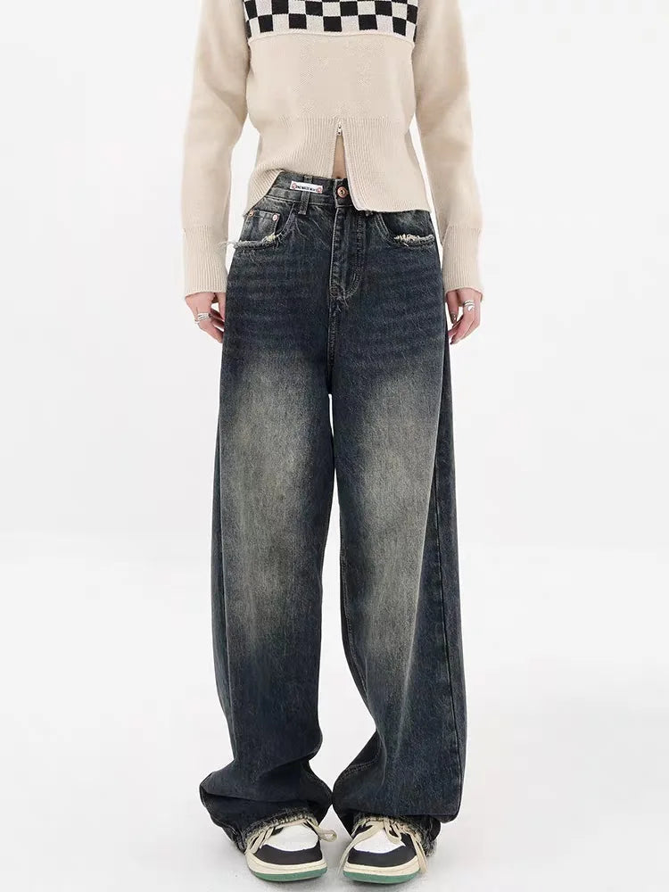 a girl is wearing y2k distressed pocket wide leg jeans for acubi style