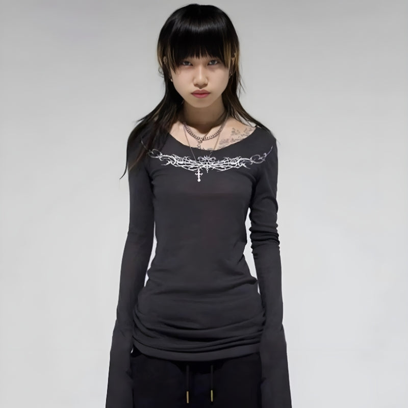 a girl is wearing a dark grey Y2K grunge barbed wire top with long sleeves and slim fit