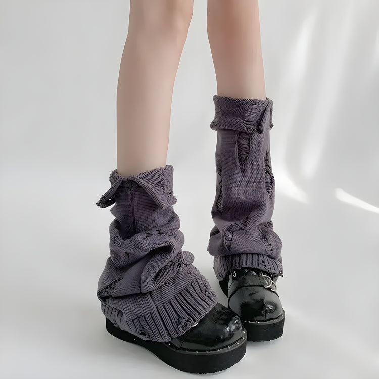 a girl is wearing y2k grunge distressed knitted leg warmers in gray for acubi fashion