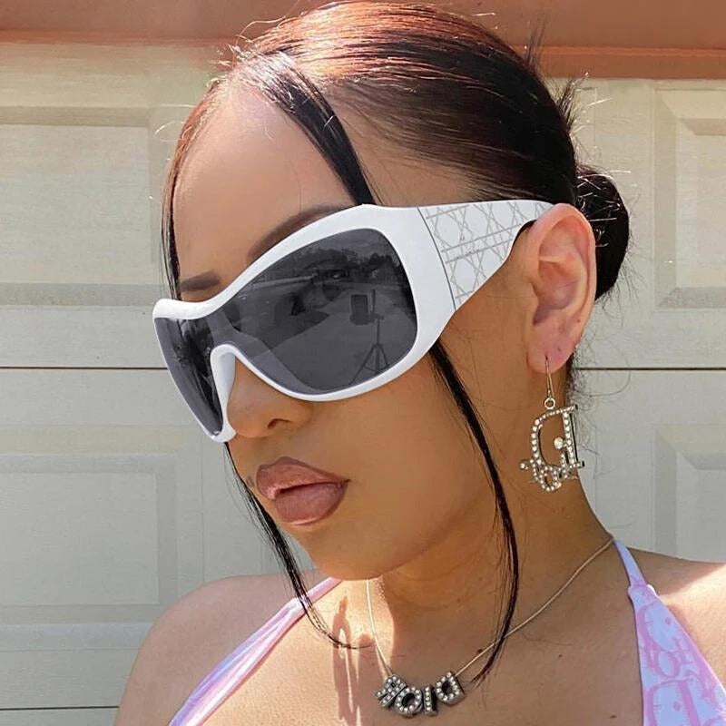 a girl is wearing Y2k Shield Sunglasses